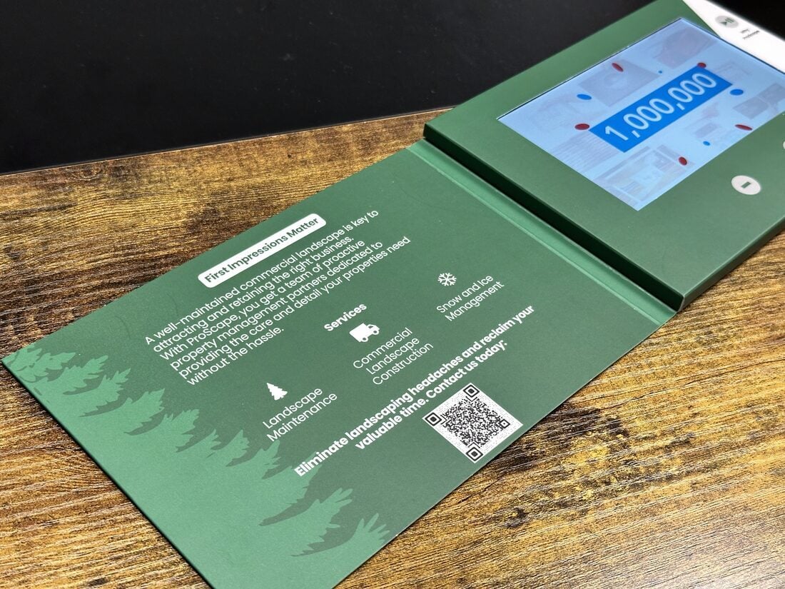 Mailer inside spread with printed copy and embedded video screen